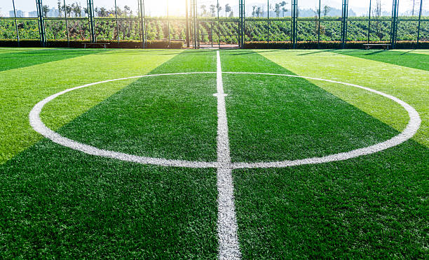 istock Empty soccer green field with circle white stripe 2228630285