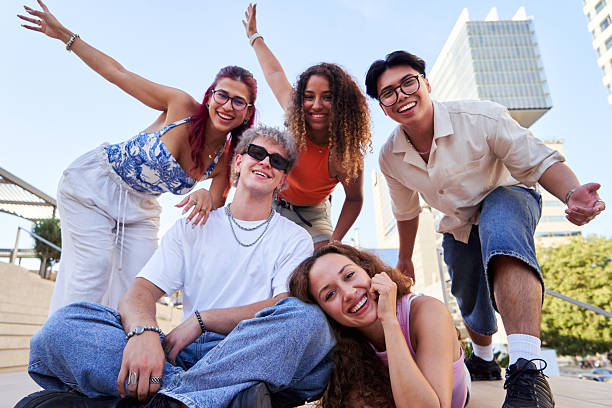 istock Group of young people smiling and having fun outdoors. 2228631749