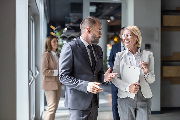 istock Two business partners sharing ideas in modern office 2228634032