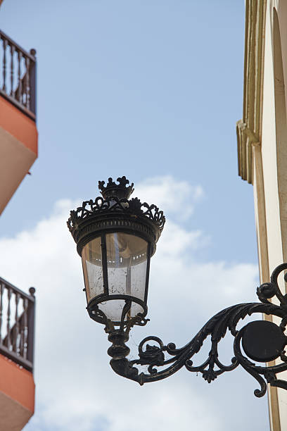 istock Weathered Danish Street Lantern with Ornate Metalwork Under Clear Sky 2228634314
