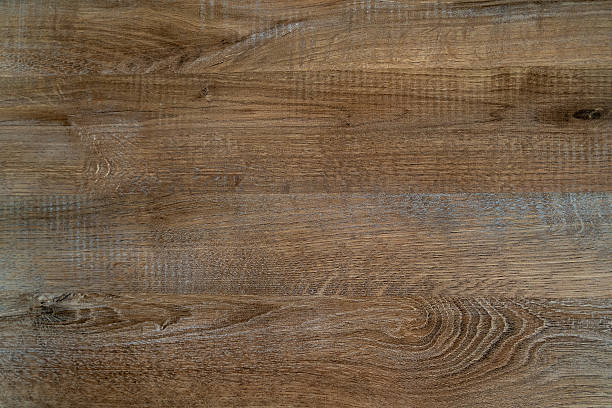 istock Textured wooden surface showcasing natural grain patterns and warm tones, ideal for backgrounds, design projects, or as a rustic element in various creative applications 2228635458
