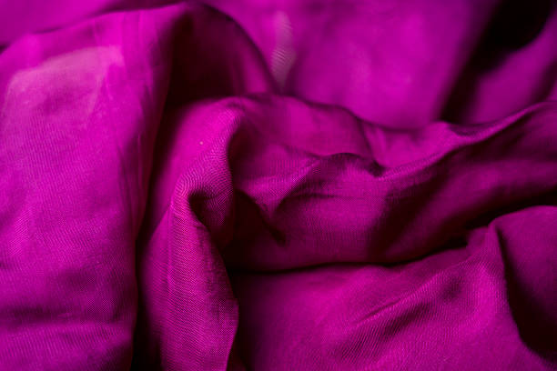 istock Vibrant Purple Fabric Texture: Close-Up Drape and Weave 2228636617