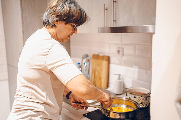 istock Woman cooking meal 2228637831