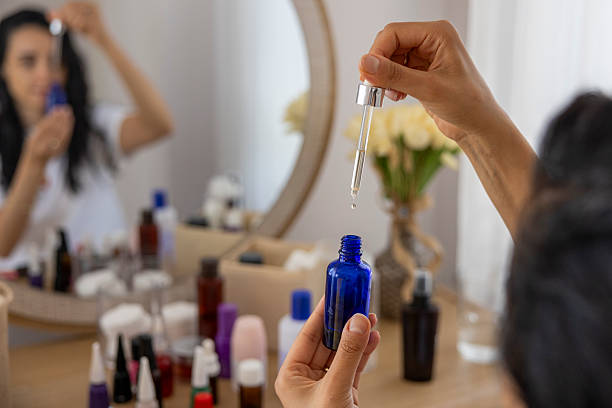 istock woman applying skincare during her beauty routine 2228637844