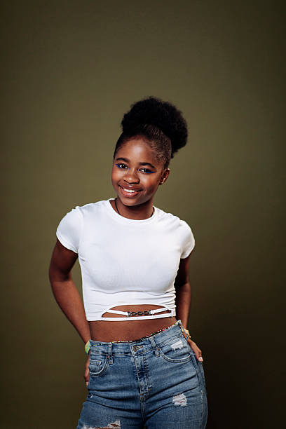 A Beautiful black teen posing on studio white background