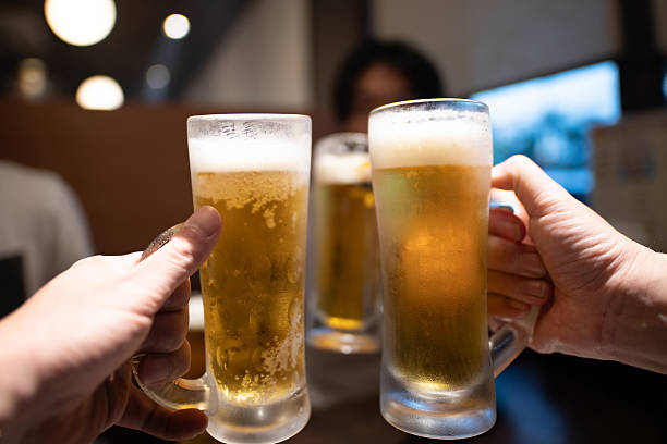 istock Hands of a man toasting with beer 2228638065