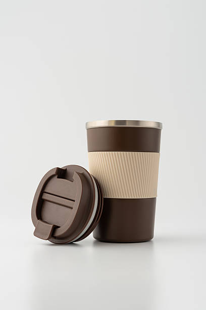 istock Brown reusable coffee thermo cup on white background 2228639629