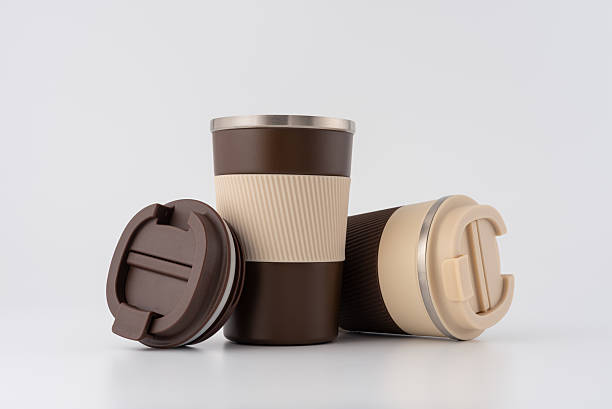 istock Brown reusable coffee thermo cups on white background 2228639630