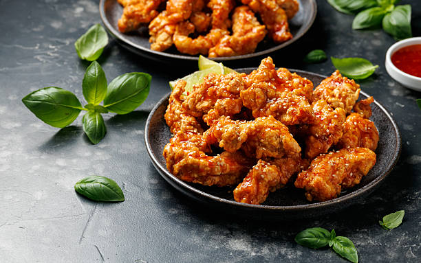 istock Korean fried chicken with spicy sauce and sesame seeds 2228639676