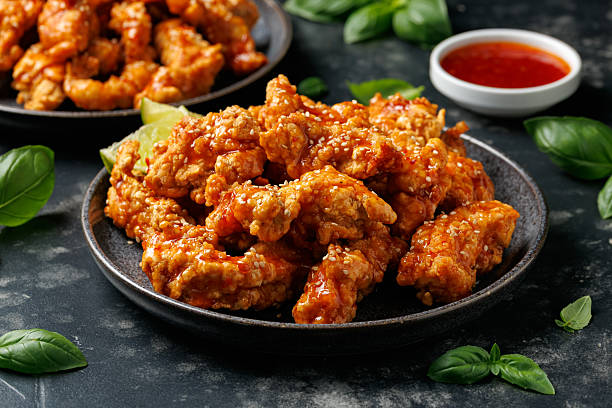 istock Korean fried chicken with spicy sauce and sesame seeds 2228639719