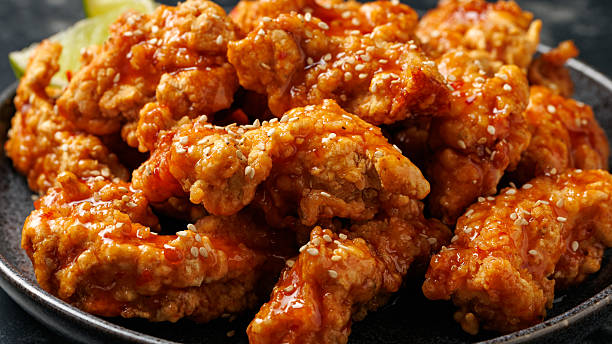 istock Korean fried chicken with spicy sauce and sesame seeds 2228639726