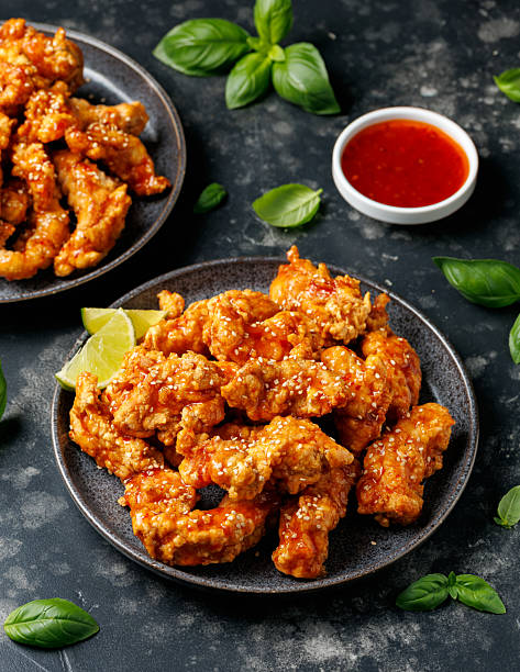 istock Korean fried chicken with spicy sauce and sesame seeds 2228639769