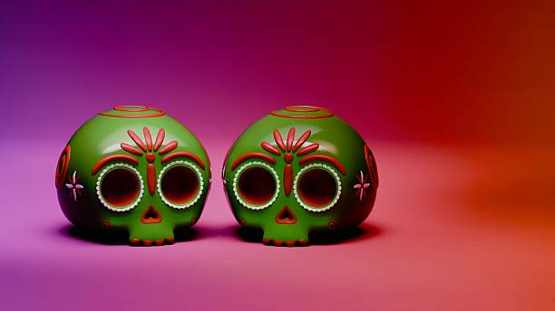Twin green sugar skulls with red floral accents on gradient backdrop