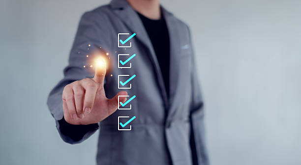 istock Businessman mark checkboxes, Survey form, check marks on checklist,Checklist concept. 2228643676