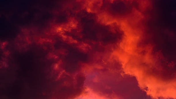 istock red cloudy mystical sky. artistic photo of clouds illuminated by setting sun. background dramatic sunset cloudscape. horizontal side view in 16x9 format 2228645028