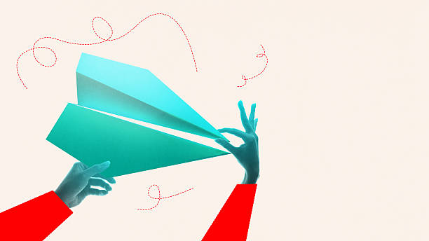 istock Digital collage. Hands launching a turquoise paper plane in motion 2228646374