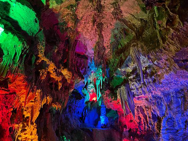 istock rainbow of colors light up Cave formations 2228648245