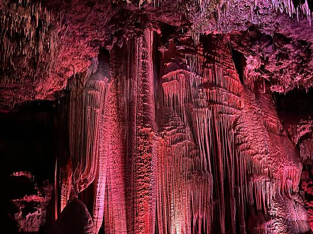 istock Grand curtain cave formation lit up in red 2228648248