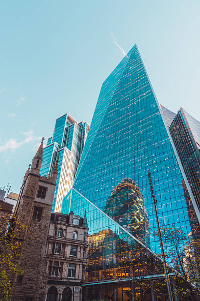 istock St Andrew Undershaft Church in front of modern skyscraper buildings background 2228649635