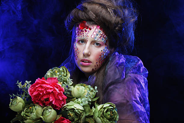 istock woman in creative image  with big flowers. 2228650068