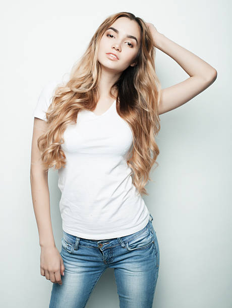 istock fashion model posing in studio, white background 2228651386