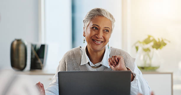 istock Excited, employee and woman with laptop, thinking and happy for published article on web and online. Creative, reporter and smile for positive feedback on email, reflection or mature person in office 2228651894