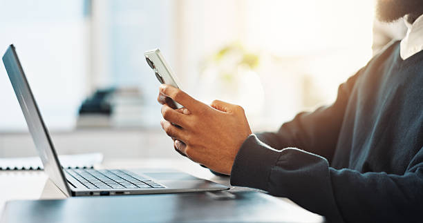 istock Hands, business and man with phone in office for research, communication and reading article. Journalist, mobile and review for story draft, proofreading and information with feedback for publication 2228651900