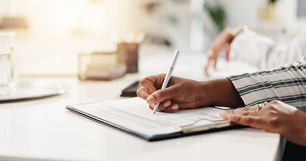 istock Employee, hands and notes for meeting, corporate and info for training seminar, secretary or office. Business, receptionist and people with notebook for agenda, writing and reminder in boardroom 2228651965
