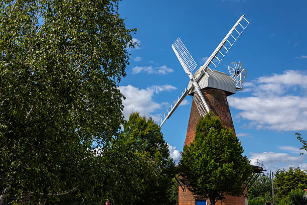 The clear blue sky forms an expansive canvas, decorated with delicate cirrus clouds stretching across the horizon