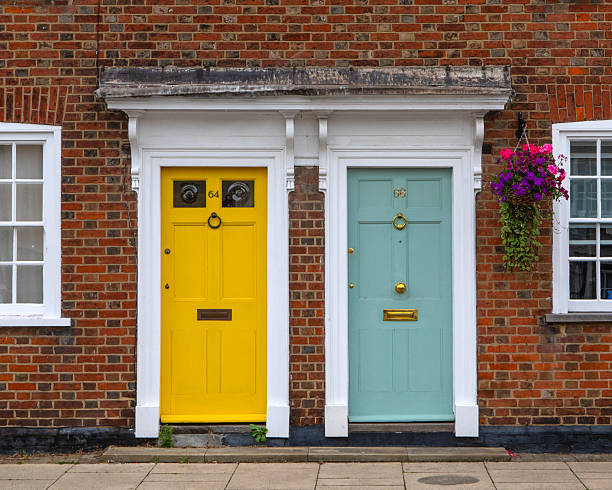 Essex, UK - July 25th 2024: Colourful doors on houses in the beautiful town of Burnham-on-Crouch in Essex, UK.