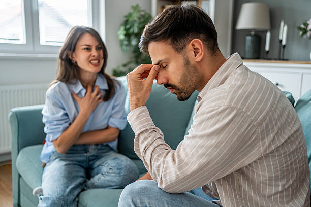 istock Young couple arguing at home on the sofa 2228654215
