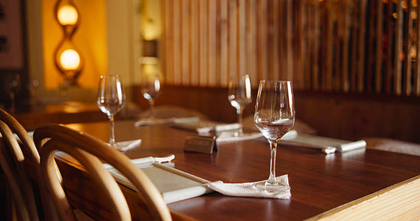 istock Reserved, empty and table setup at restaurant for private event, celebration and dining experience. Glasses, layout and interior setting with catering service, lunch banquet and party for New years 2228656235