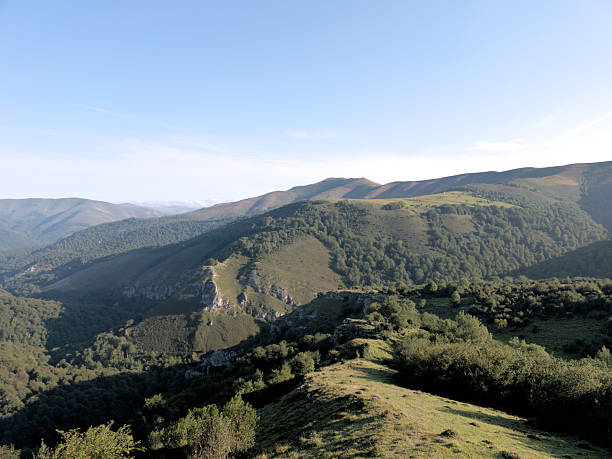 istock Panoramic View of Cuetos Lush Fields and Forests, Cantabria 2228657670