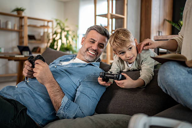 istock Father and son bonding over video games 2228657805