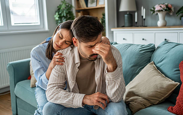 istock Young couple supporting each other during difficult times at home 2228658748