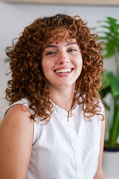 istock Young business woman smiling and looking at camera 2228659249