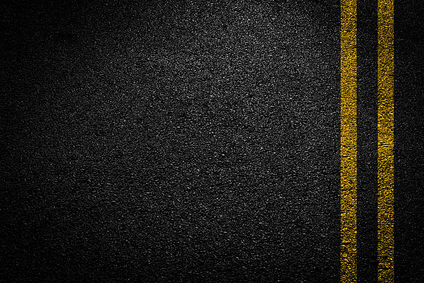 istock Double Yellow Line On New Asphalt Road texture background 2228660259