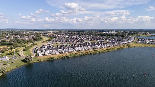 istock Aerial suburban view by a lake 2228661616