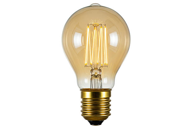 istock Isolated Vintage Style Edison Light Bulb with Gold Base 2228662020