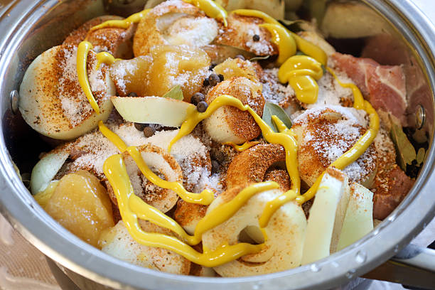 istock Ingredients for shish kebab are marinating in a pot, creating an appetizing look. Meat with onions, mustard, and spices is waiting to be cooked. 2228662477