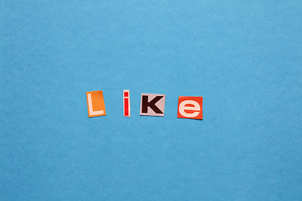 Hand holding a speech bubble like reactions. Social media high engagement concept.
