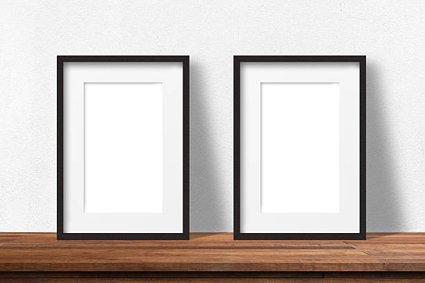 istock Minimal empty vertical wooden picture frame mockup. White wall with elegant stucco decor. Portrait large poster a3, a2 mock-up. Wooden table. Modern, minimal design, Scandinavian indoor interior. 2228669638