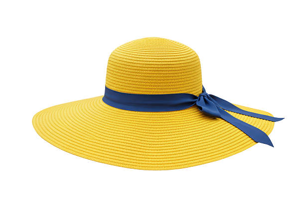 Cropped image of a solo Asian woman traveler walking with a stylish straw hat while exploring Georgetown, Penang.