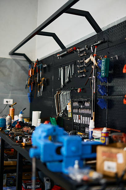 istock Workbench and pegboard organizing tools in auto repair shop 2228677094