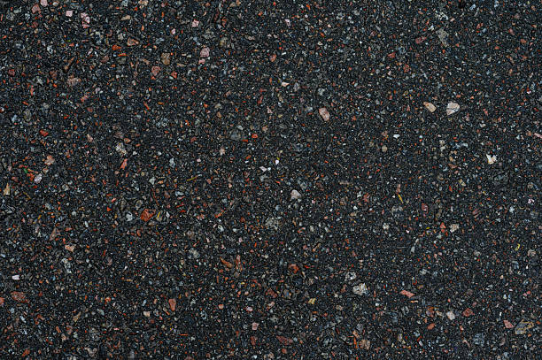 istock Dark Gray and Black Gravel Texture with Small Multicolored Stones 2228677240