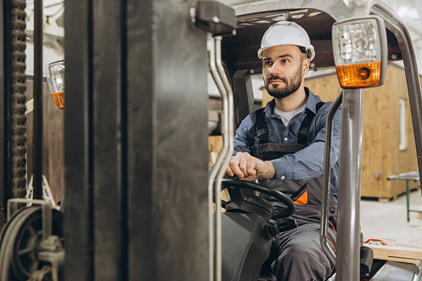 istock Warehouse worker driving forklift in modular building industry 2228677925