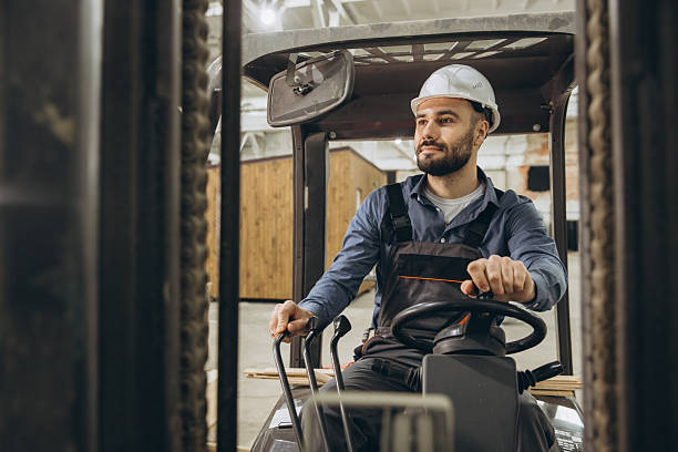 istock Construction worker driving forklift in modular building factory 2228677965