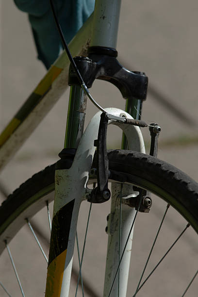 A detailed close up of a bicycle featuring a sturdy black tire, showcasing its intricate design and robust construction, emphasizing its functionality and style
