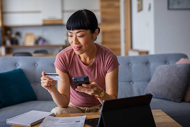 istock Relaxed Woman Making Online Purchases at Home 2228679736