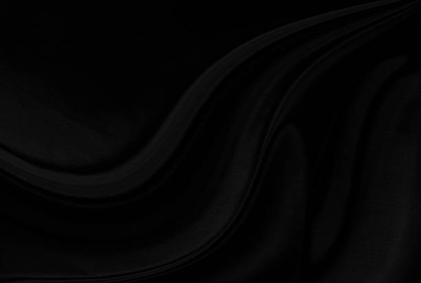 istock Black gray satin dark fabric texture luxurious shiny that is abstract silk cloth background with patterns soft waves blur beautiful. 2228684306